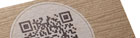 photo of letterpress business card with simulated wood grain and QR code
